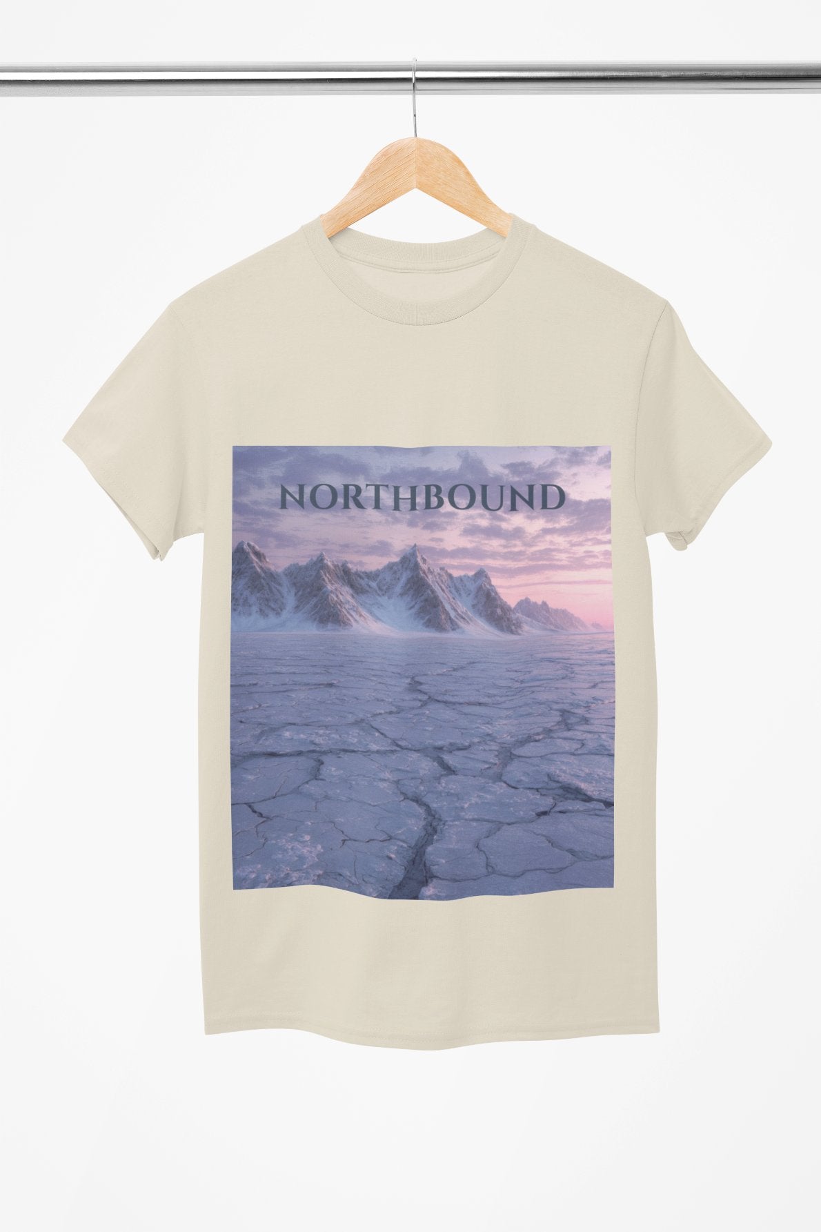 Beige t-shirt with a graphic of mountains and 'Northbound' text on a hanger.