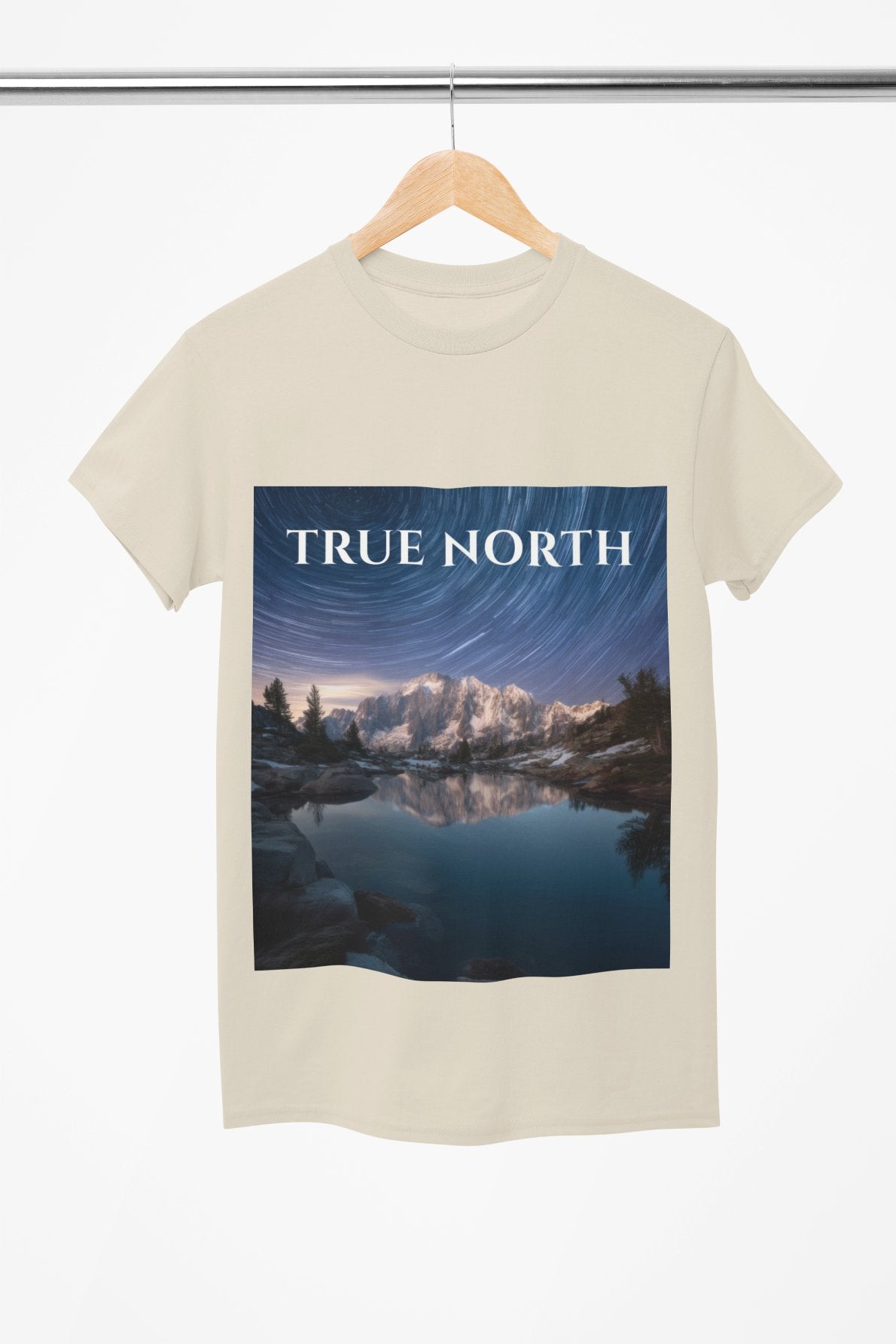 Beige t-shirt with 'True North' graphic design on a hanger