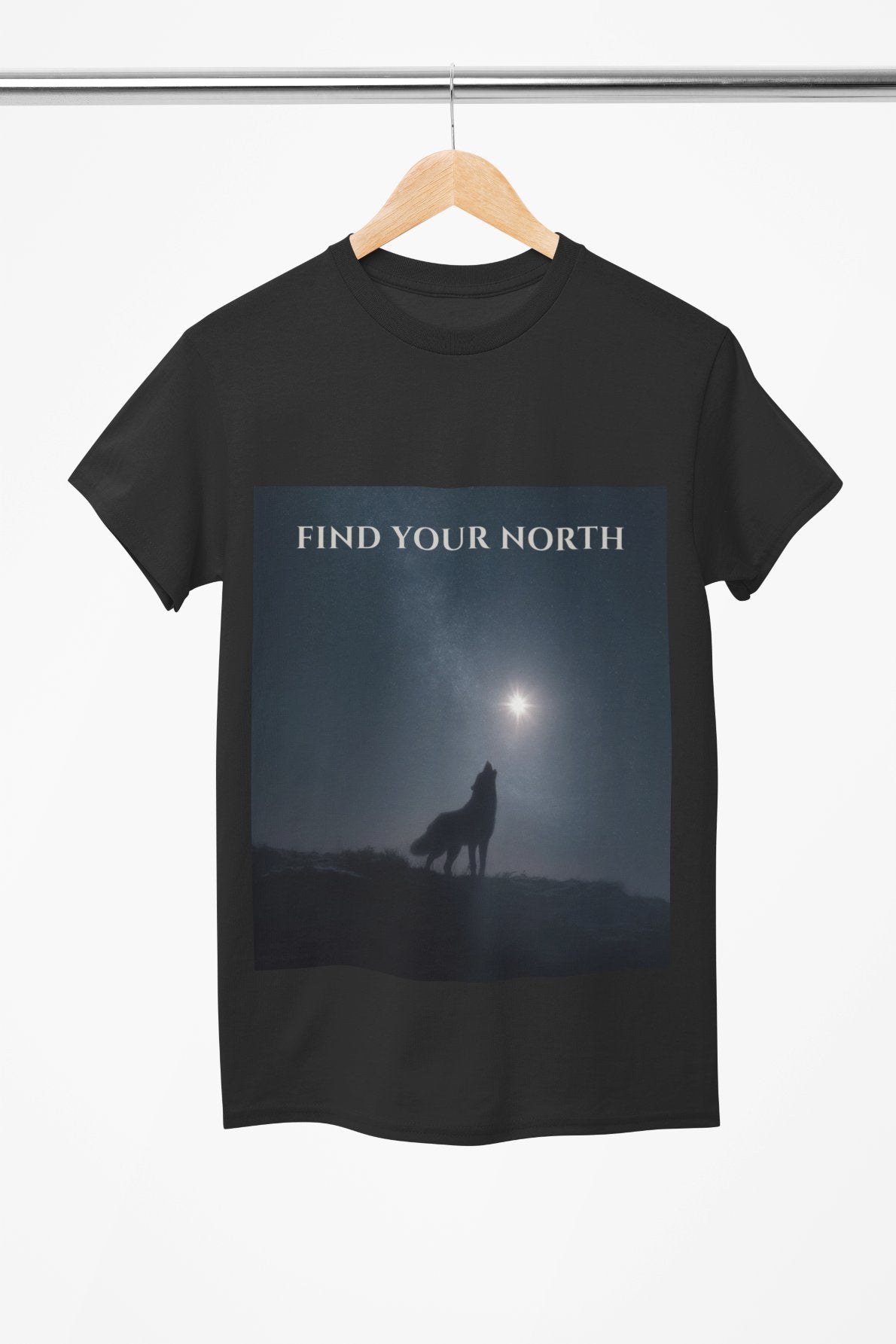 Black t-shirt with a wolf graphic and 'Find Your North' text on a hanger against a white background