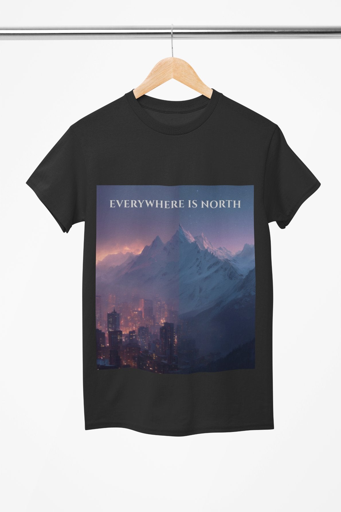 Black t-shirt with a mountain and cityscape design and 'EVERYWHERE IS NORTH' text on a hanger.
