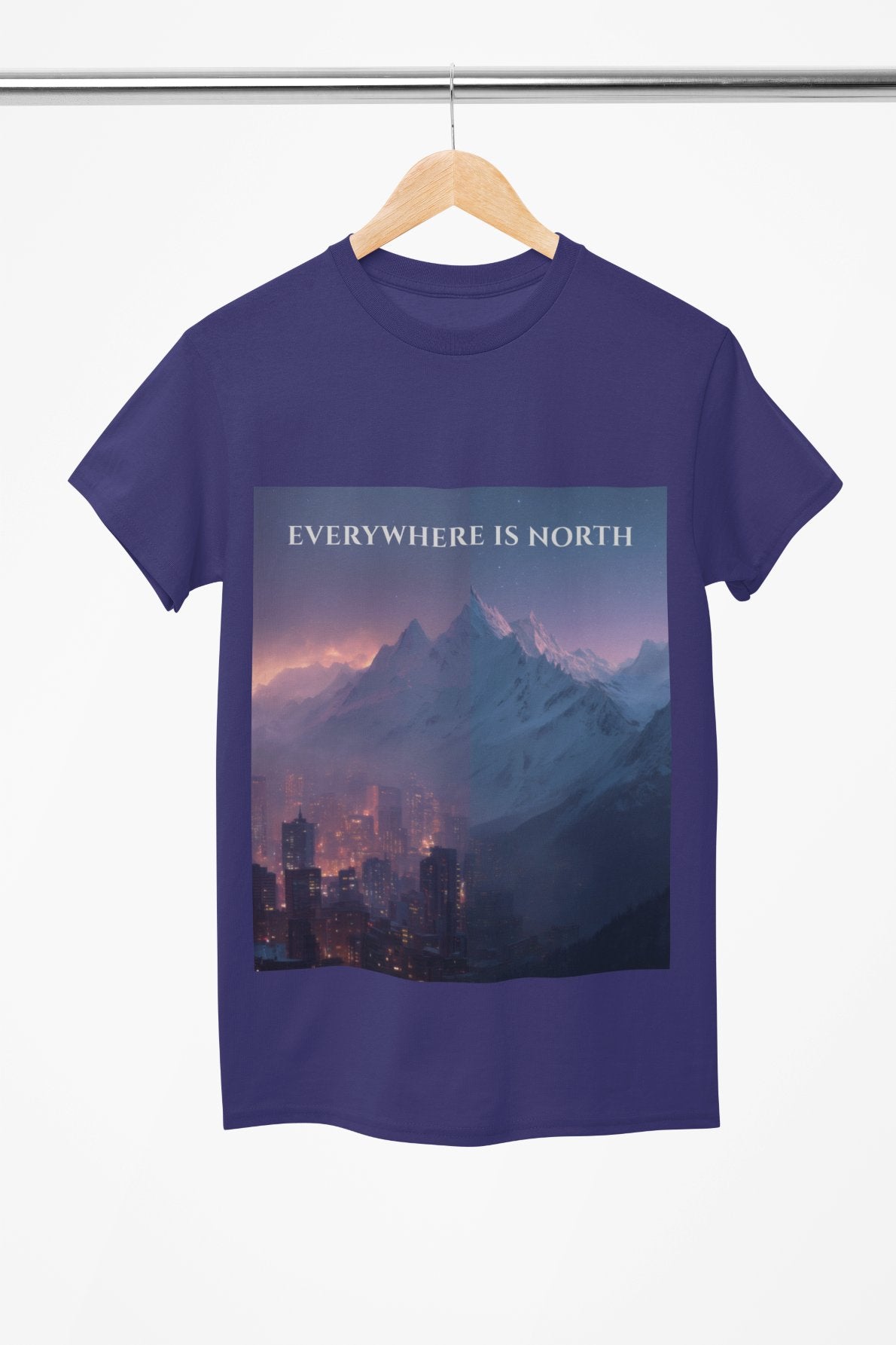 Blue t-shirt with mountain and city design and 'EVERYWHERE IS NORTH' text on a white background