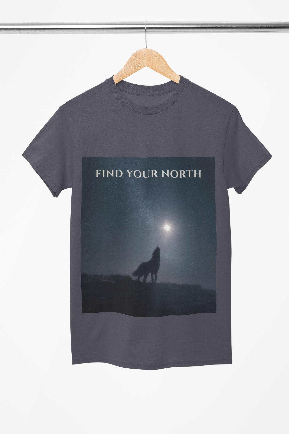 T-shirt with a wolf silhouette and 'Find Your North' text on a hanger.
