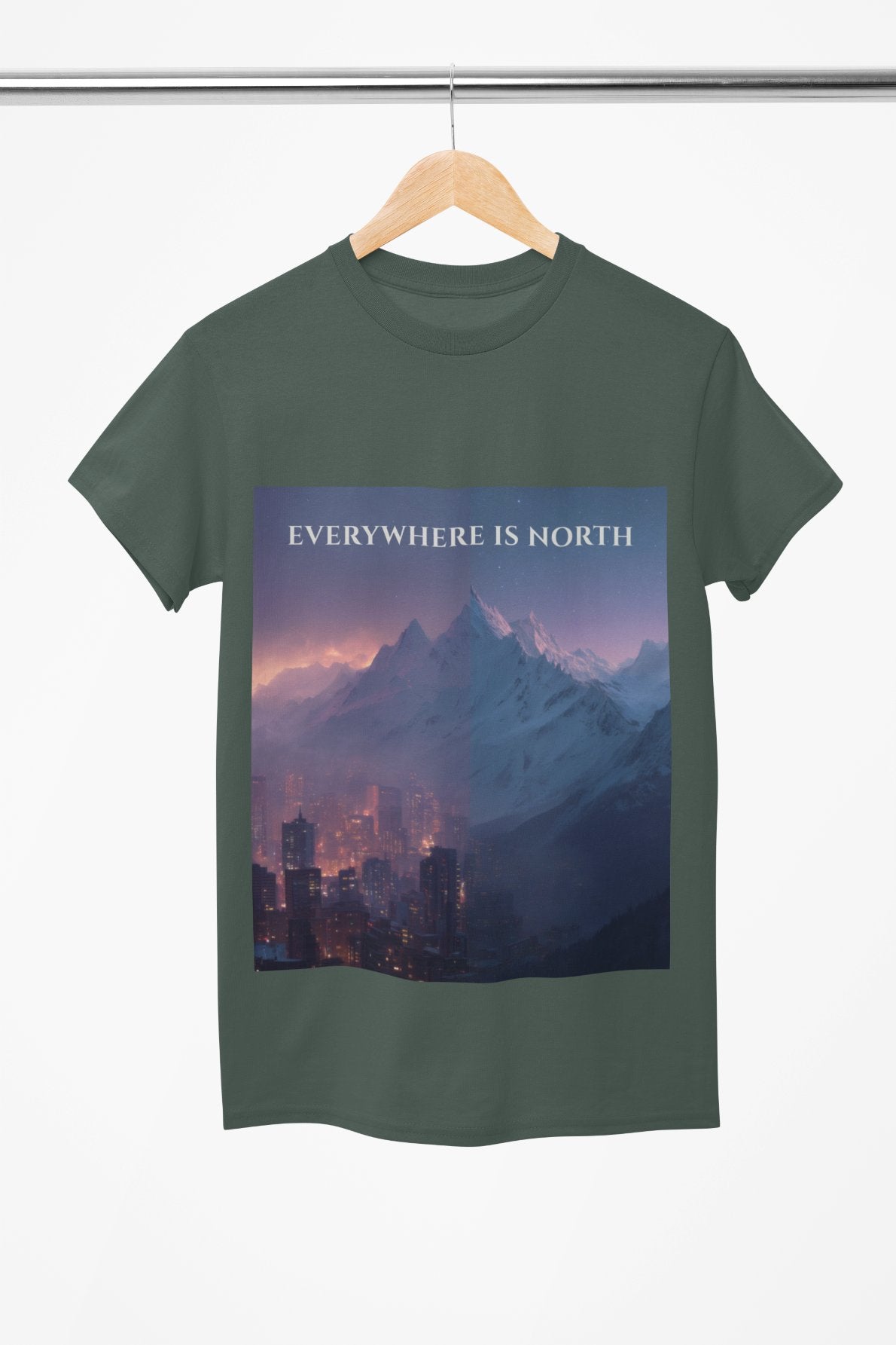 Green t-shirt with a mountain and cityscape design and 'EVERYWHERE IS NORTH' text on a hanger.
