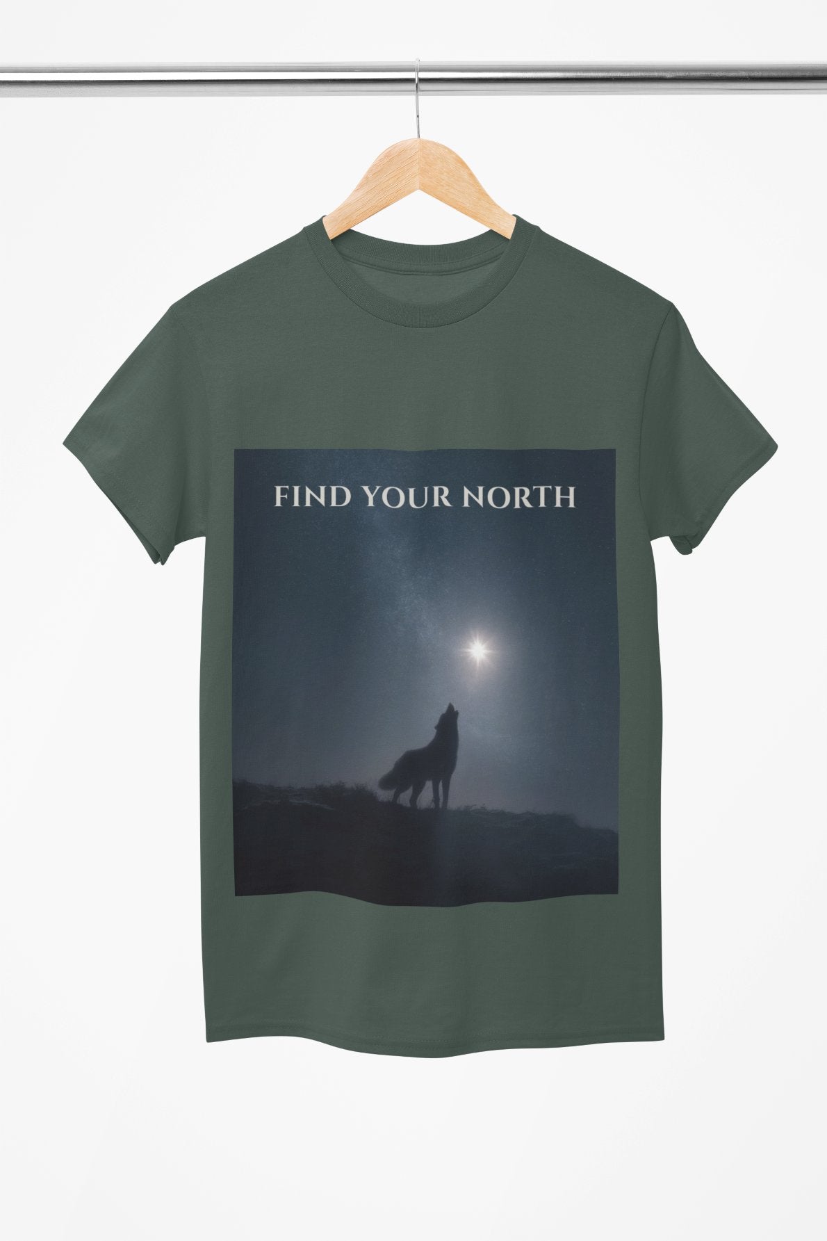 Green t-shirt with a wolf silhouette and 'Find Your North' text on a hanger.
